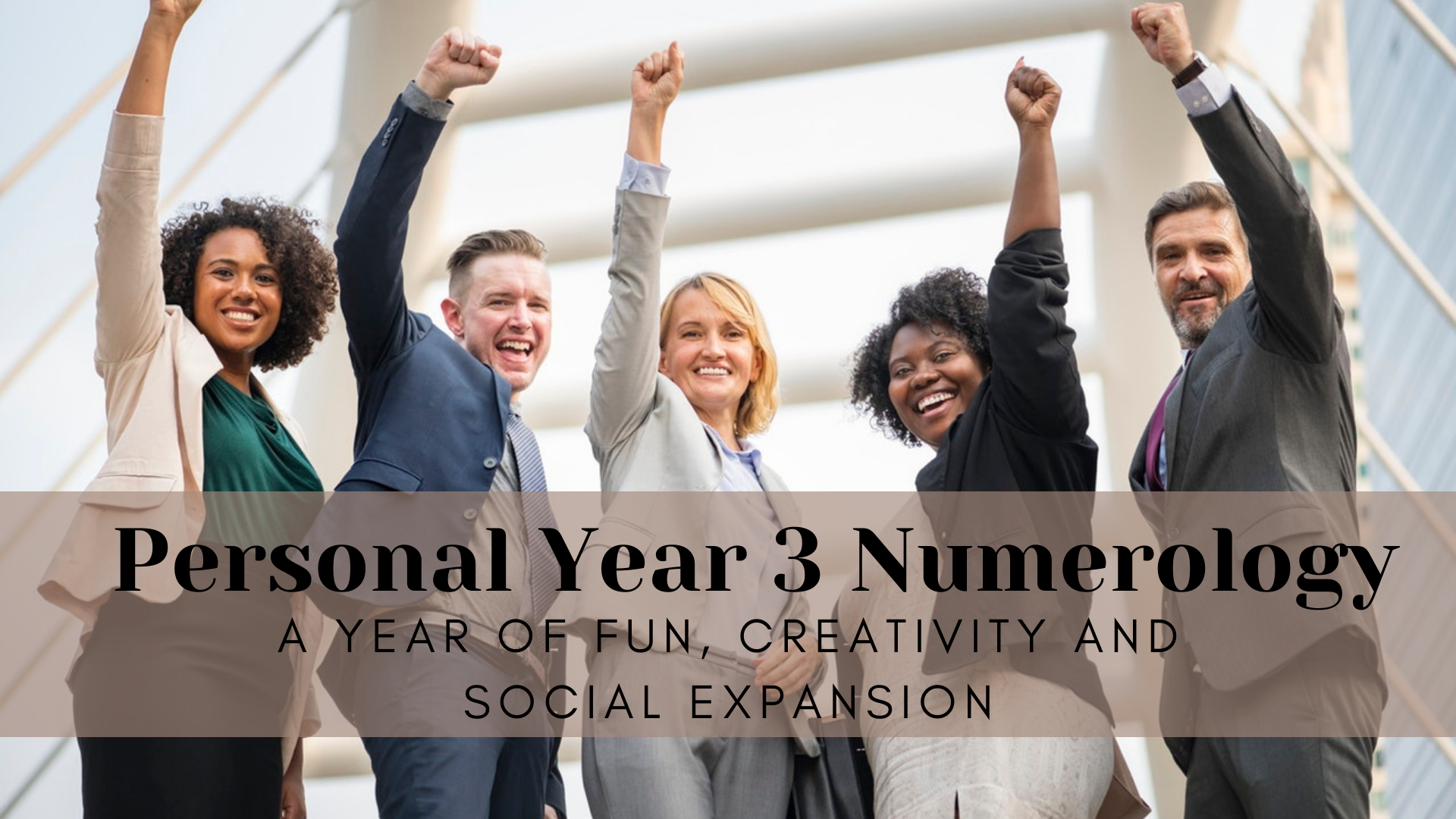 A group of corporate people who are smiling and raising their hands with words Personal Year 3 Numerology